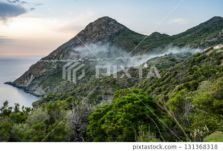 Coastline view Roadtrip Winding road along rocky coast of Cap Corse peninsula on Corsica island France 131368318