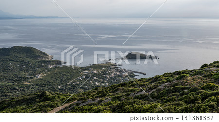 Village beach view Roadtrip Winding road along rocky coast of Cap Corse peninsula on Corsica island France 131368332