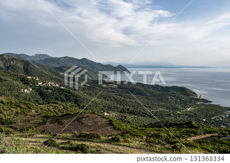 Village beach view Roadtrip Winding road along rocky coast of Cap Corse peninsula on Corsica island France Village beach view Roadtrip Winding road along rocky coast of Cap Corse peninsula on Corsica island France 131368334