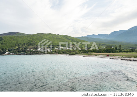 Village beach view Roadtrip Winding road along rocky coast of Cap Corse peninsula on Corsica island France 131368340