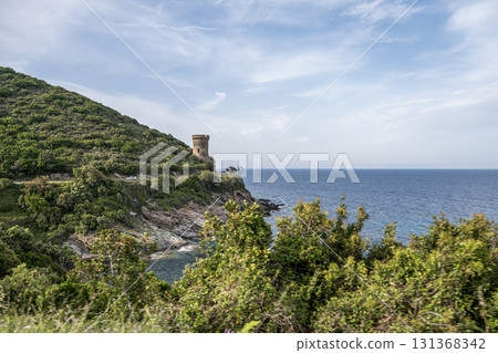 Watchtower view Roadtrip Winding road along rocky coast of Cap Corse peninsula on Corsica island France Watchtower view Roadtrip Winding road along rocky coast of Cap Corse peninsula on Corsica island France 131368342