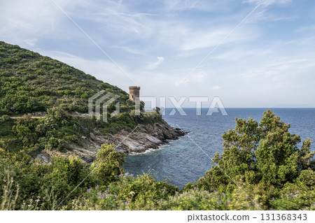 Watchtower view Roadtrip Winding road along rocky coast of Cap Corse peninsula on Corsica island France Watchtower view Roadtrip Winding road along rocky coast of Cap Corse peninsula on Corsica island France 131368343