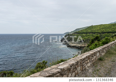 Coastline view Roadtrip Winding road along rocky coast of Cap Corse peninsula on Corsica island France 131368346