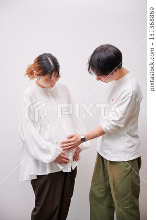 Couple facing each other, pregnant woman, maternity 131368869