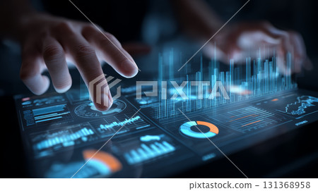 Futuristic digital tablet with holographic data charts and graphs being manipulated by hands dark environment showing advanced technology 131368958