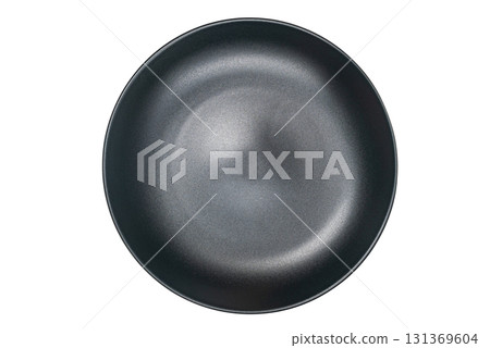 Top view or flat lay of single empty black ceramic plate. 131369604