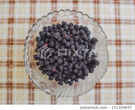 Plate with berries black blackberries Plate with berries black blackberries 131369697