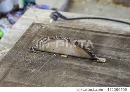 Disc circular saw. Drive for sawing wood 131369706