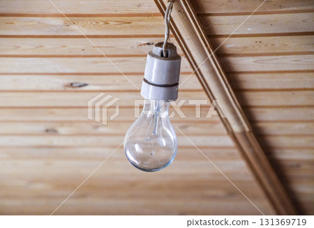 Simple white bowl with an incandescent lamp. 131369719