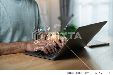 Person working on laptop with artificial intelligence concept, hands typing, casual setting, technology in focus, brainstorming ideas, creative process Person working on laptop with artificial intelligence concept, hands typing, casual setting, technology in focus, brainstorming ideas, creative process 131370402