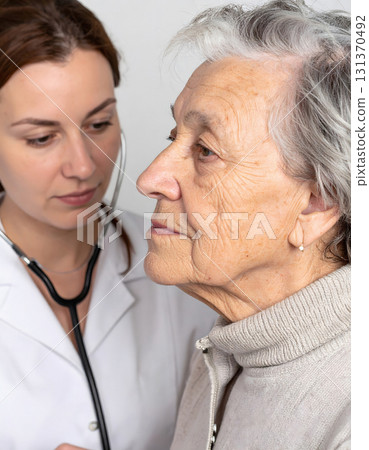 Professional woman doctor advising patient with medical expertise 131370492