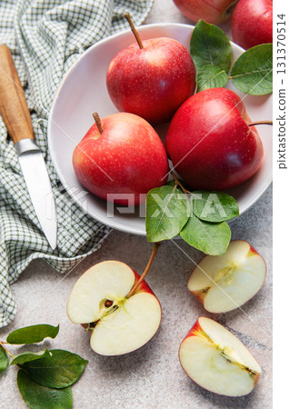 Fresh red apples in bowl with knife Fresh red apples in bowl with knife 131370514