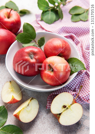 Fresh red apples in white bowl on table Fresh red apples in white bowl on table 131370516