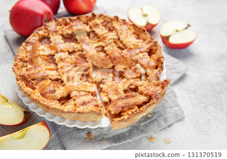 Apple pie with lattice crust and fresh apples 131370519