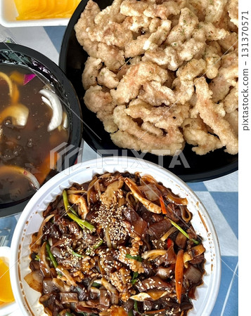 A classic Korean-Chinese combo of jajangmyeon with thick, chewy noodles coated in rich black bean sauce, served alongside crispy tangsuyuk, deep-fried pork with sweet and sour sauce. A classic Korean-Chinese combo of jajangmyeon with thick, chewy noodles coated in rich black bean sauce, served alongside crispy tangsuyuk, deep-fried pork with sweet and sour sauce. 131370571