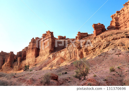 Picturesque scenery of Charyn Canyon in the sunset light, northern region of Tien Shan Mountains. Famous landmark Natural monument Valley of Castles, National Nature Park, Almaty region, Kazakhstan 131370696
