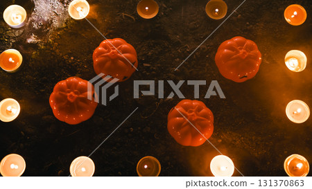 Pumpkin cemetery with matches on Halloween night Pumpkin cemetery with matches on Halloween night 131370863