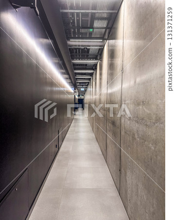 Minimalistic photo of a modern concrete corridor with LED lights and metallic ceiling structure. Perfect for backgrounds, architecture, and urban concepts. High quality photo Minimalistic photo of a modern concrete corridor with LED lights and metallic ceiling structure. Perfect for backgrounds, architecture, and urban concepts. High quality photo 131371259