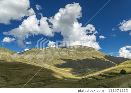 Sibylline mountains and plains of Castelluccio di Norcia, Umbria, Italy 131371315