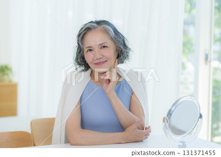 Senior woman doing skin care Senior woman doing skin care 131371455