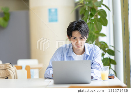 College students studying in the cafeteria College students studying in the cafeteria 131371486