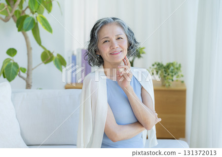 Senior woman doing skin care Senior woman doing skin care 131372013