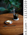 Iced coffee and lemon cake for a snack 131372039