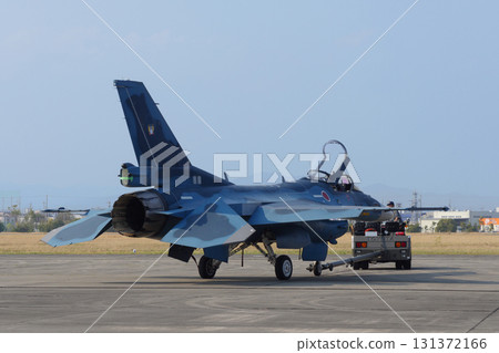Air Self-Defense Force F-2 fighter jet being towed 131372166