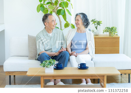 Senior couple relaxing in the living room 131372258