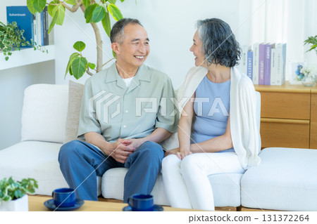Senior couple relaxing in the living room 131372264