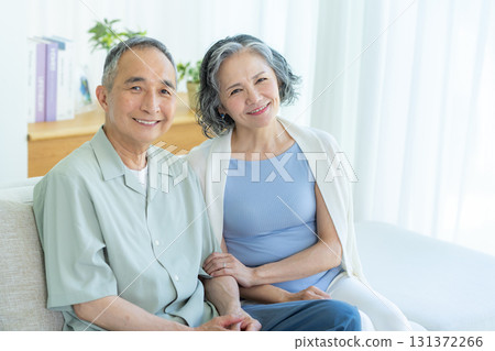 Senior couple relaxing in the living room 131372266