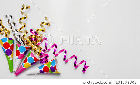 Festive background: Bright whistles and streamers on a white background with space for text. 131372302