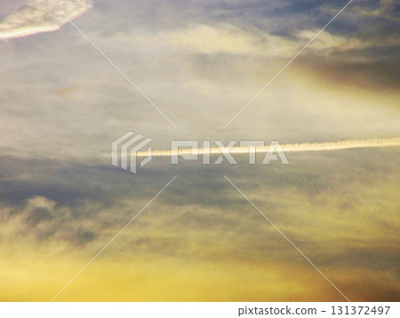 Landscape of sunset sky and contrails 131372497