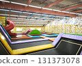 Colorful indoor trampoline park with slides, mats, and fun play areas for kids and families. Perfect for recreation, parties, and active entertainment.  131373078