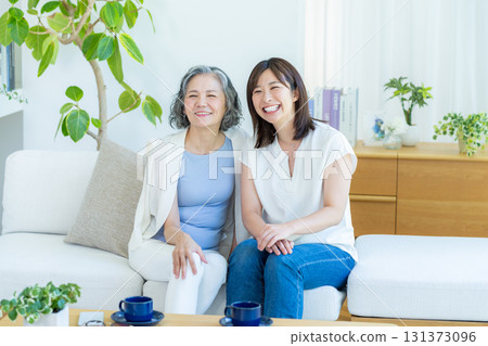 Good friends and parents relaxing in the living room Good friends and parents relaxing in the living room 131373096