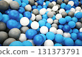 Colorful plastic balls in a play pool, featuring blue, white, and gray shades. Fun indoor playground detail, perfect for kids parties, recreation, and festive celebrations. Background.  131373791