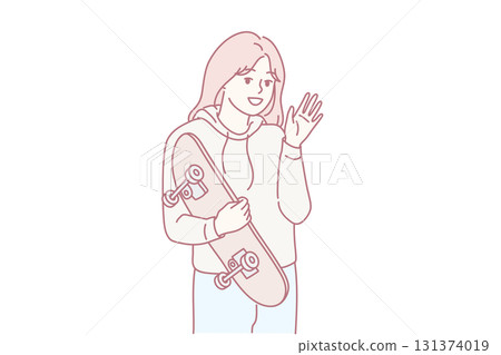 Smiling girl posing with skateboard 131374019