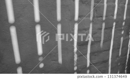 Old concrete wall, natural texture. Light background. Shadows from the fence. 131374649