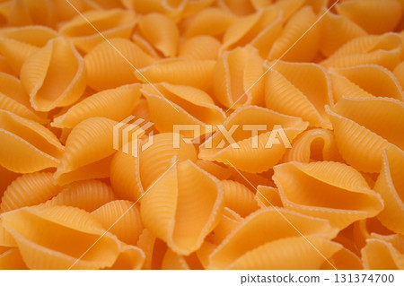 Dry conch shell pasta close-up. Dry conch shell pasta close-up. 131374700
