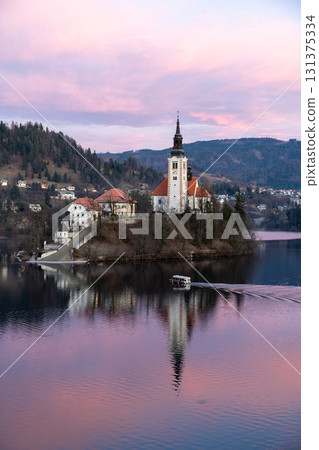 Church on Lake Bled with Pletna Boat at Sunset, Slovenia 131375334