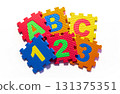 Colorful Foam Puzzle Pieces with Letters and Numbers 131375351