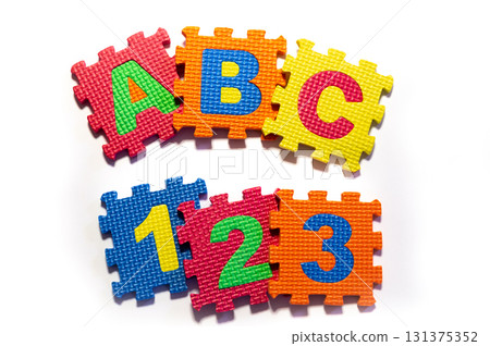 Colorful Foam Puzzle Pieces with Letters and Numbers Colorful Foam Puzzle Pieces with Letters and Numbers 131375352