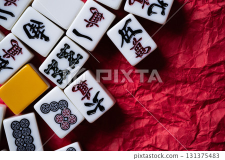 Mahjong tiles on a red background 131375483