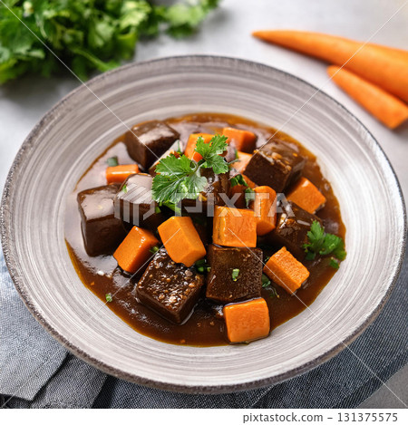 Black Bean Curd Served with Carrot Sauce 131375575