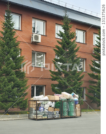 Building with Trees and Overfilled Storage Cage Building with Trees and Overfilled Storage Cage 131375626