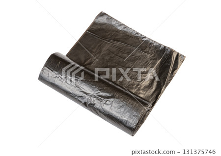 roll of black plastic garbage bags for waste collection and storage isolated on white background. New rolled plastic bin bags 131375746