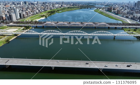 Drone aerial shot of bridges and roads over rivers 131376095