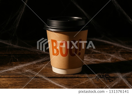 Paper coffee cup with BOO text surrounded by spider webs, perfect for Halloween or spooky themed designs. Paper coffee cup with BOO text surrounded by spider webs, perfect for Halloween or spooky themed designs. 131376141