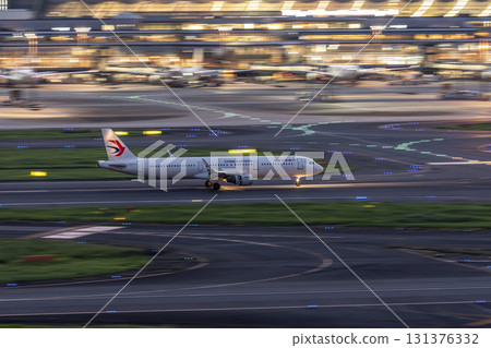 Haneda Airport at dusk, airplane landing, Ota Ward, Tokyo Haneda Airport at dusk, airplane landing, Ota Ward, Tokyo 131376332