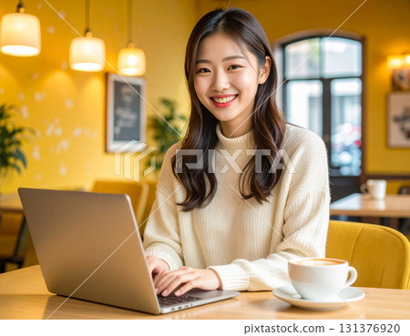 A young woman operating a personal computer 131376920